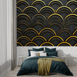 Art deco black and gold wallpaper creating drama in a modern living room setting