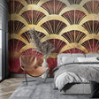 Art deco fan pattern wallpaper in a modern dining room with gold and burgundy details catching evening light