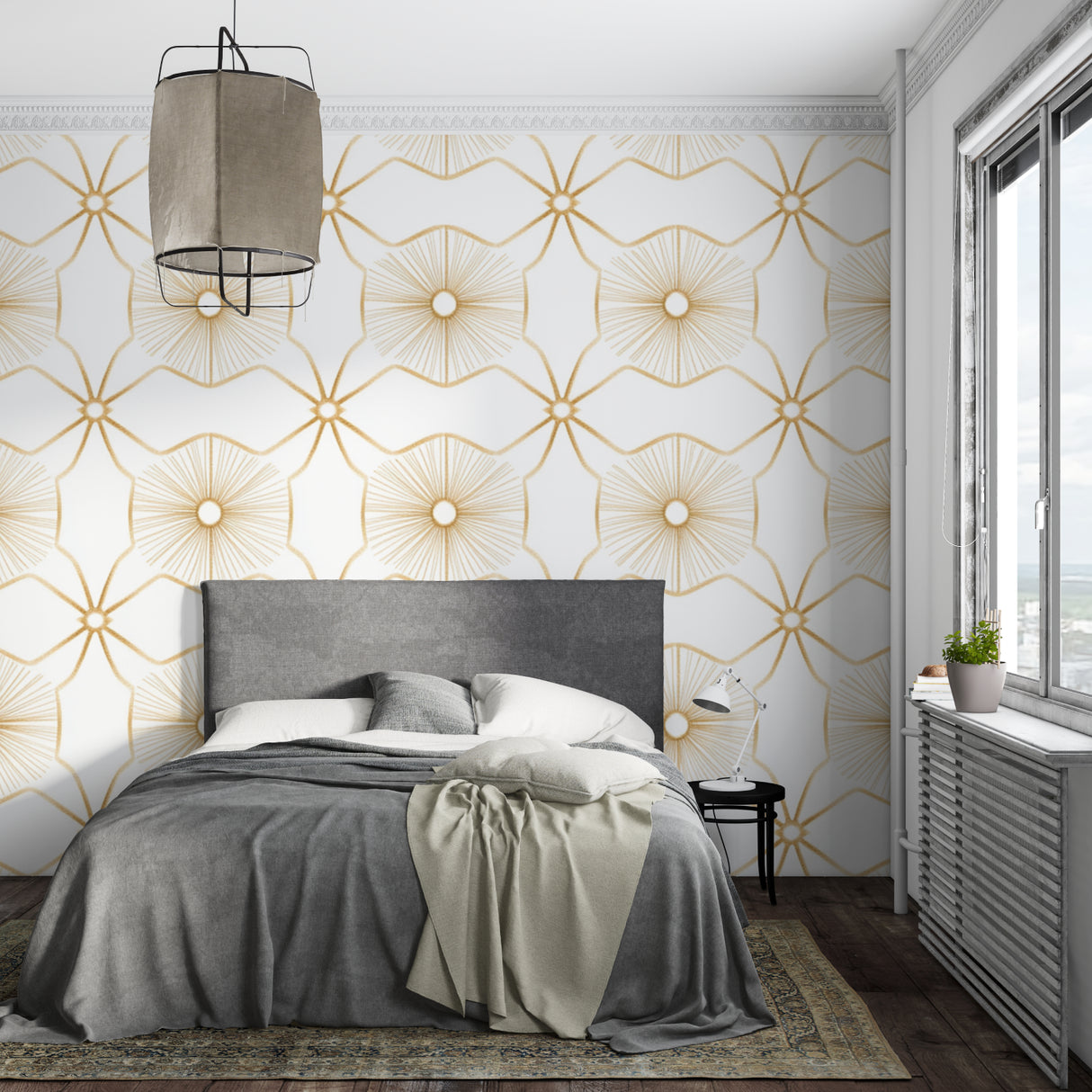 Gold sunburst wallpaper creating elegant backdrop in dining room with crystal chandelier