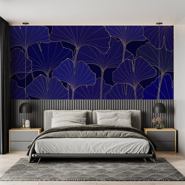 Navy and gold Art Deco wallpaper with ginkgo leaves pattern in modern living room creating elegant atmosphere