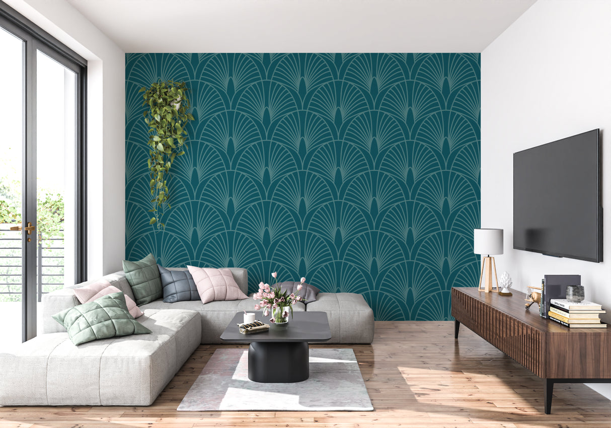 Art deco teal fan pattern wallpaper in modern living room with grey sofa and brass accents