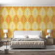 Art deco fan pattern wallpaper in yellow and orange creating a warm atmosphere in a modern dining room setting