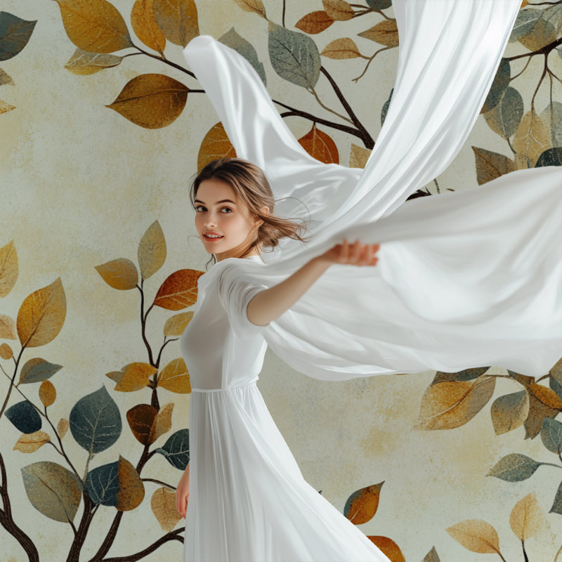 Botanical leaf mural adding warmth to a minimalist dining room