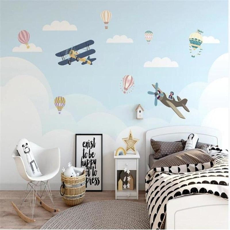 Playroom featuring aviation themed wallpaper with floating hot air balloons and biplanes