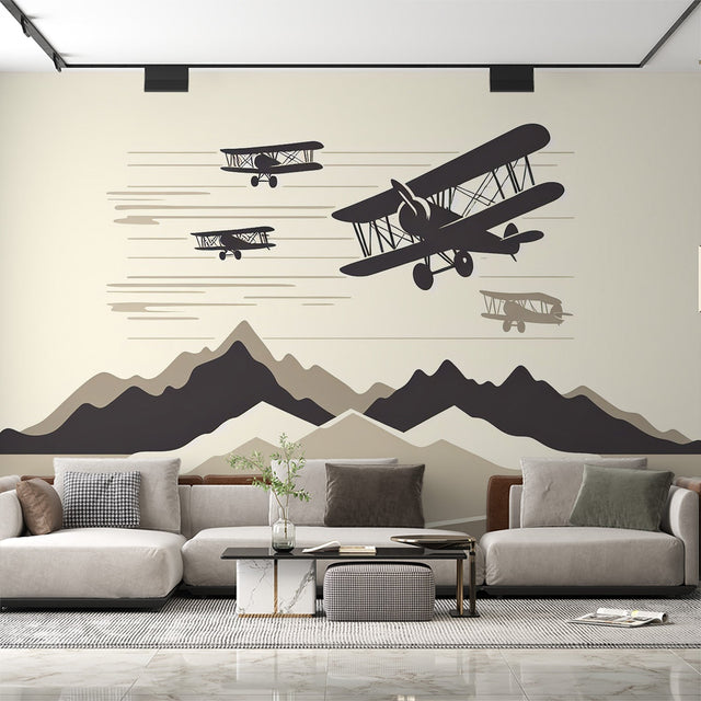 Aviation wallpaper in modern living room showing vintage planes and mountains creating depth and movement