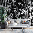 Black and white bamboo forest wallpaper creating depth in a modern minimalist living room with clean lines and natural light