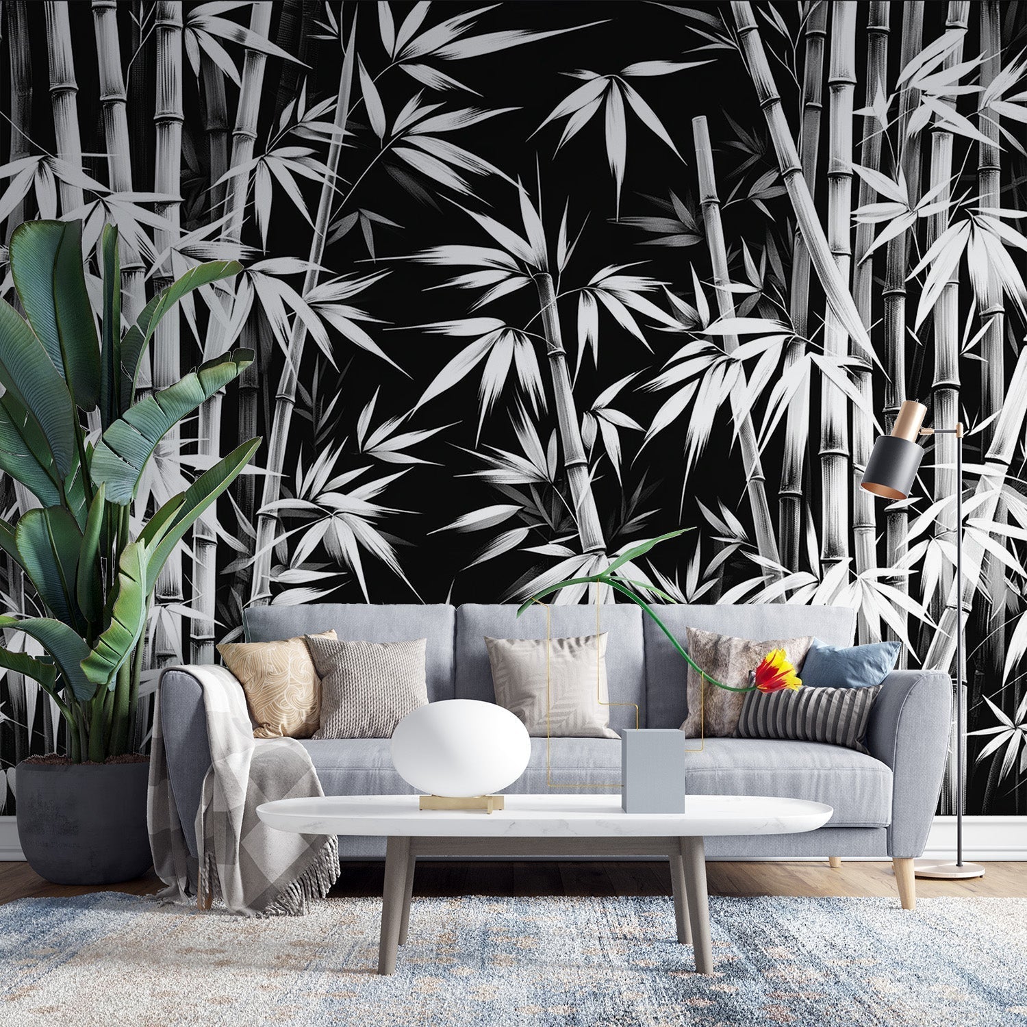 Black and white bamboo forest wallpaper creating depth in a modern minimalist living room with clean lines and natural light