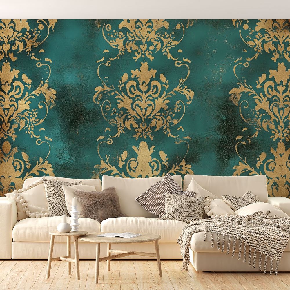 Baroque green and gold damask wallpaper in an elegant dining room with crystal chandelier and dark wood furniture