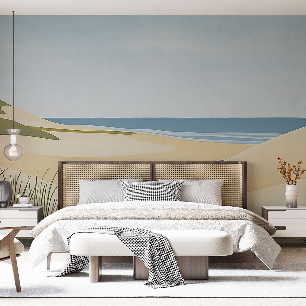 Beach wallpaper mural shown in modern living room, highlighting the minimalist coastal dunes design against white furniture