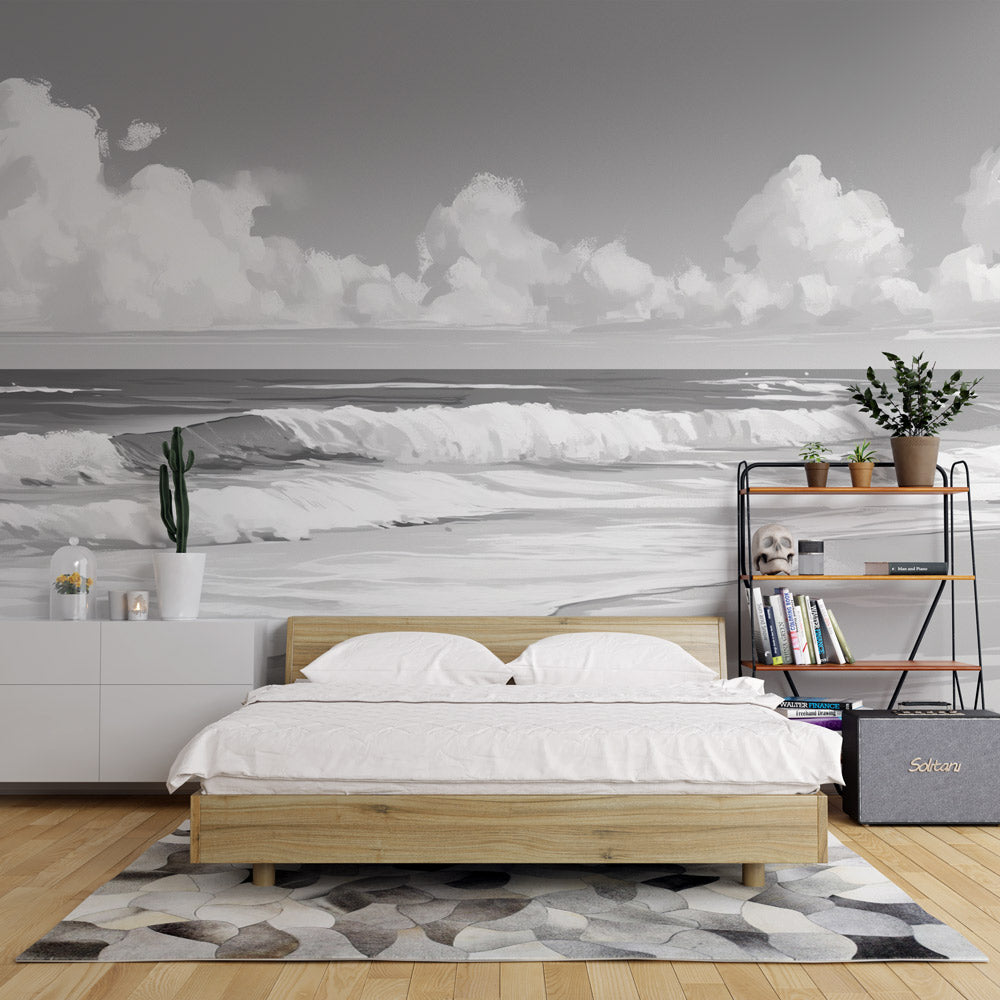Black and white beach wallpaper creating a stunning focal point in a modern living room with minimalist furniture