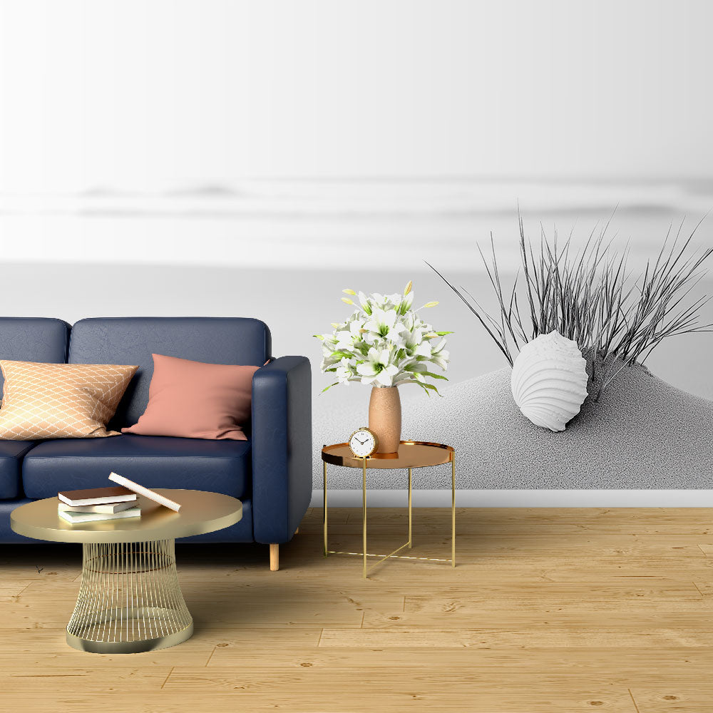 Black and white beach scene wallpaper creating a calm atmosphere in a modern living room with minimal furniture