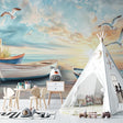 Beach mural wallpaper creating a coastal vibe in modern living room with gray sofa
