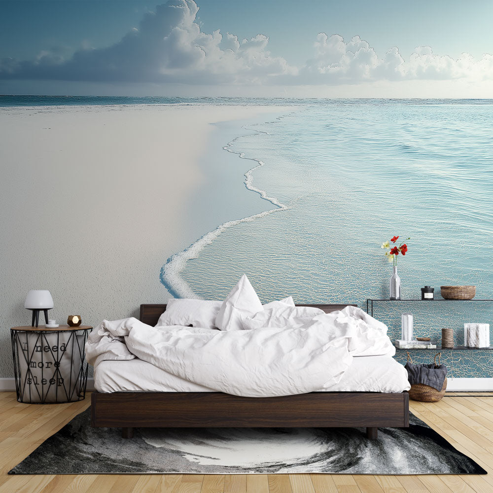 Beach mural wallpaper creating a stunning coastal atmosphere in a modern living room with white furniture