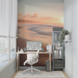Beach sunset wallpaper in modern living room with coastal decor