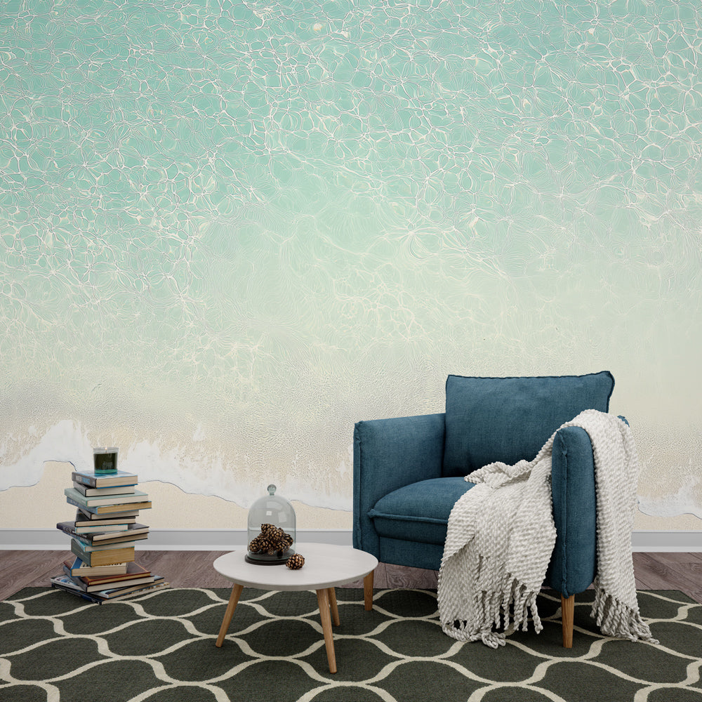 Beach scene wallpaper creating a serene atmosphere in a modern living room with natural light