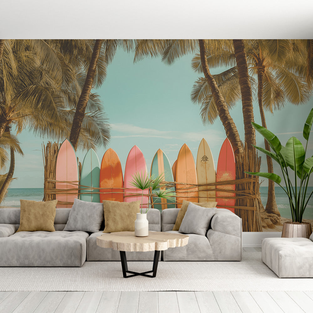 Beach wallpaper with vintage surfboards and palm trees shown in a bright modern living room with coastal decor