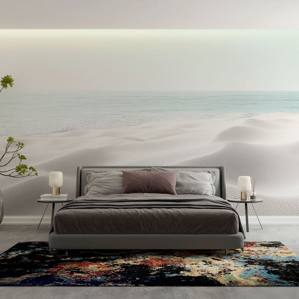 Beach landscape wallpaper creating a serene atmosphere in a modern living room with white furniture and natural light