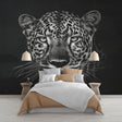 Black and white leopard wallpaper mural creating dramatic impact in a modern living room with minimalist furniture