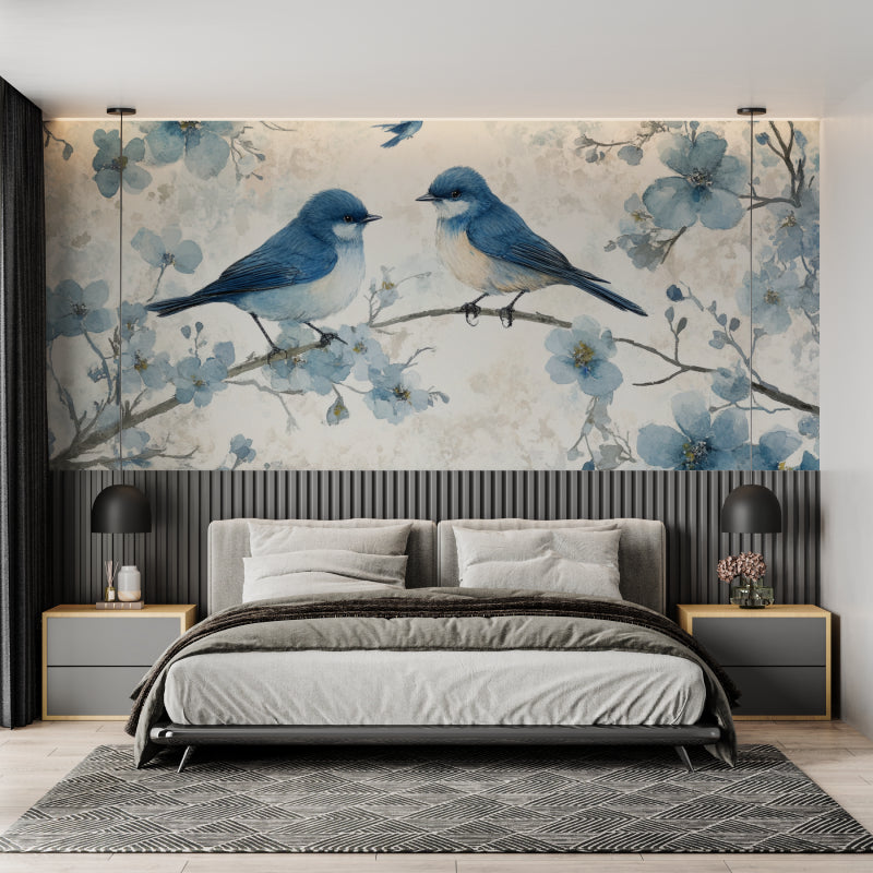 Blue bird wallpaper mural styled in bright modern bedroom showing cherry blossoms and songbirds
