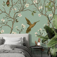 Birds wallpaper mural with cherry blossoms and hummingbirds creating a peaceful atmosphere in a bright living room
