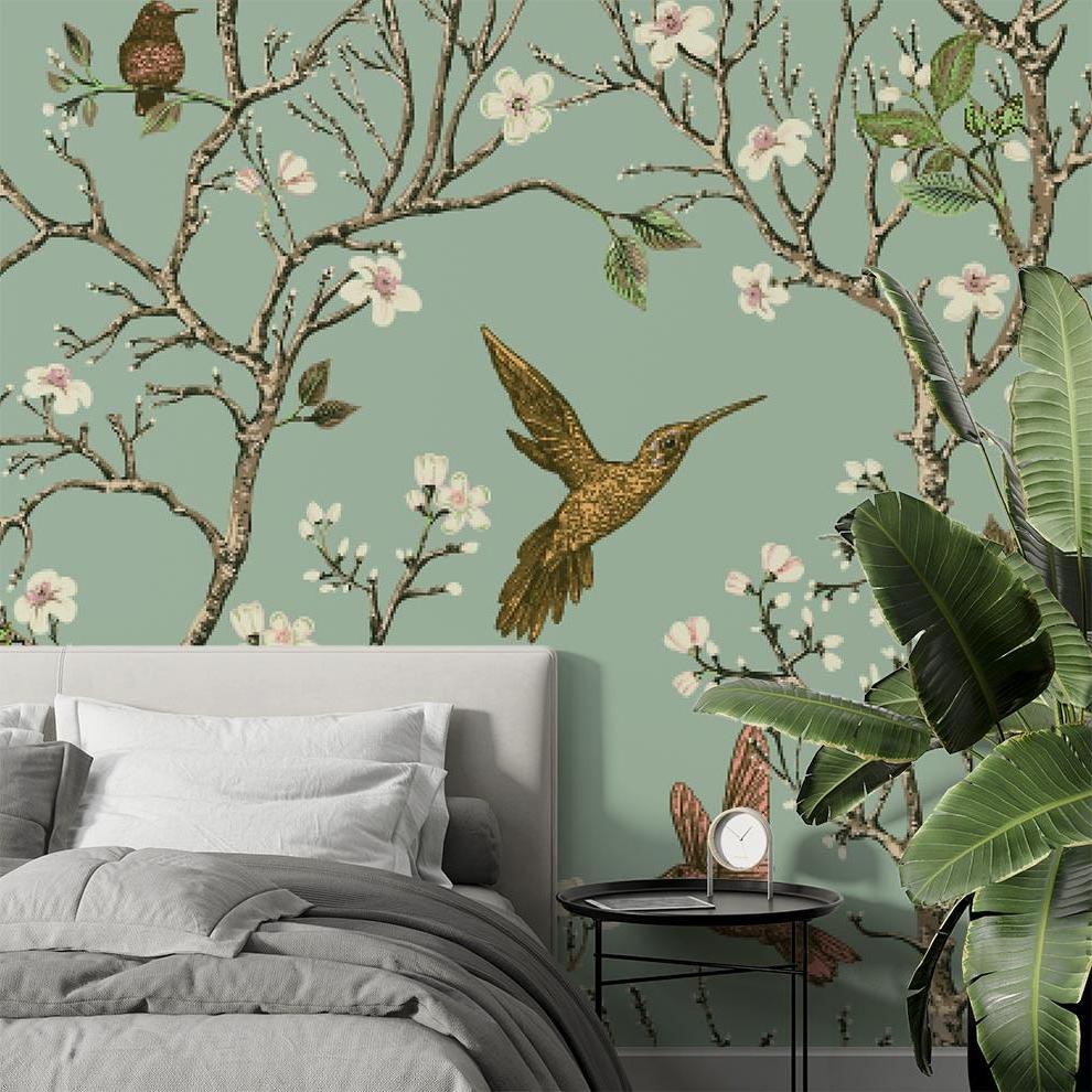 Birds wallpaper mural with cherry blossoms and hummingbirds creating a peaceful atmosphere in a bright living room