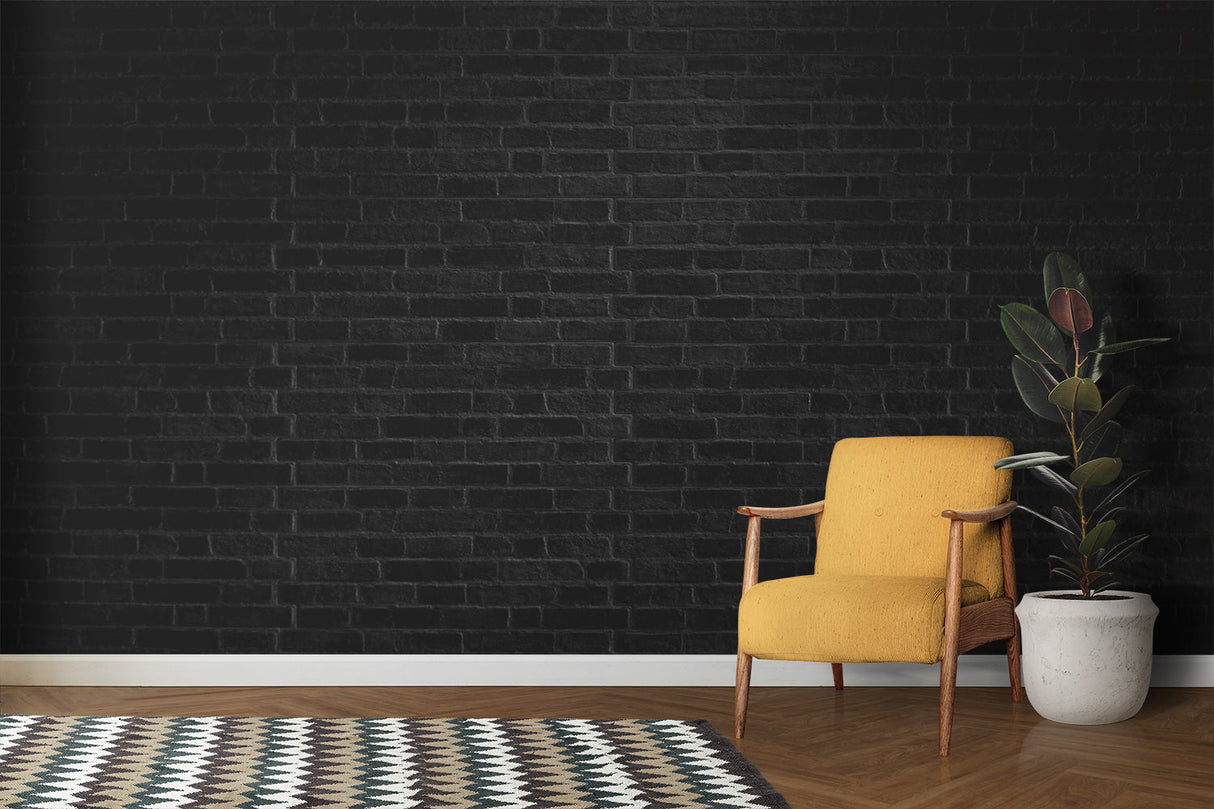 Industrial black brick mural in home office with white desk setup