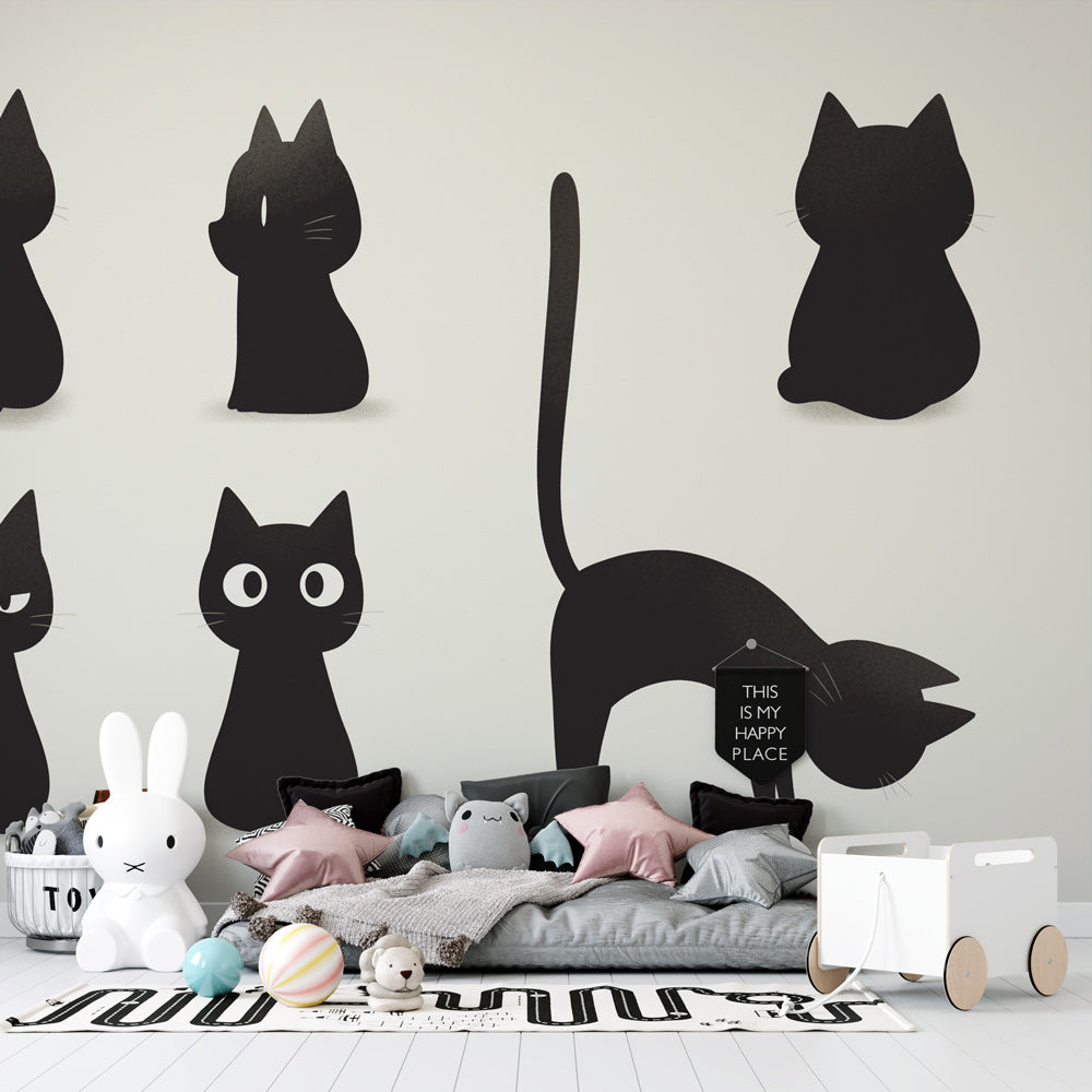Black cat silhouette wallpaper displayed in a modern minimalist living room, creating a bold graphic statement wall