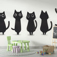 Black cat wallpaper mural styled in a modern Scandinavian living room, showing clean minimalist design impact