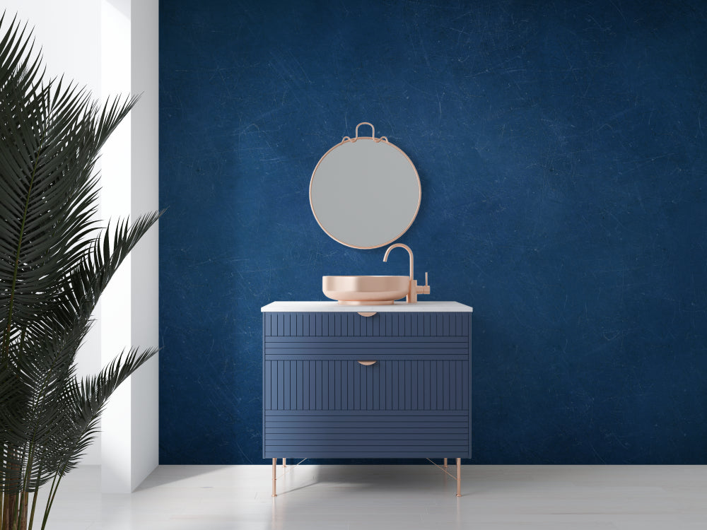 Dining room with navy blue wall design showing texture detail in evening light