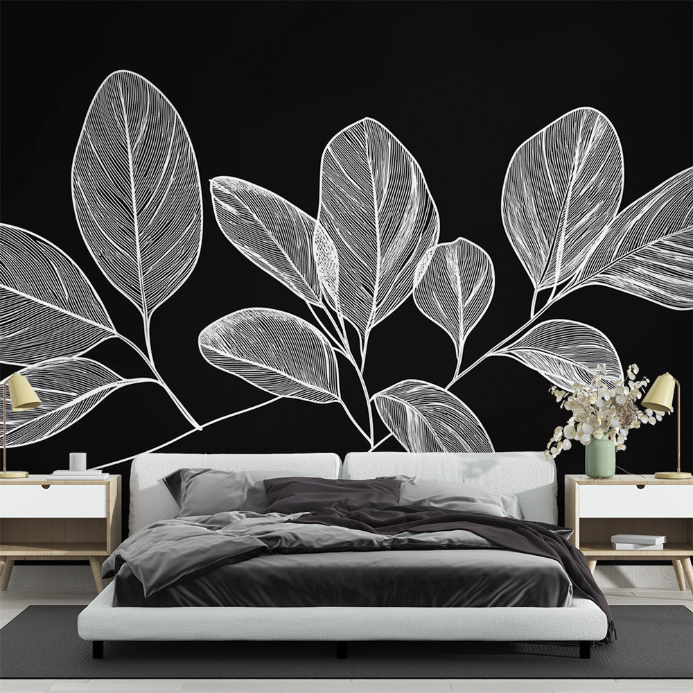 Black and white botanical line art wallpaper creating a modern statement wall in a minimalist living room setting