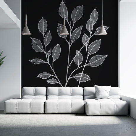 Black and white botanical line art wallpaper creating drama in a modern living room with minimal furniture