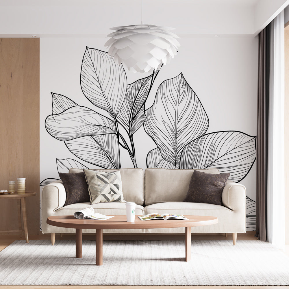 Black line art botanical wallpaper creating a modern statement wall in a bright, minimalist living room setting