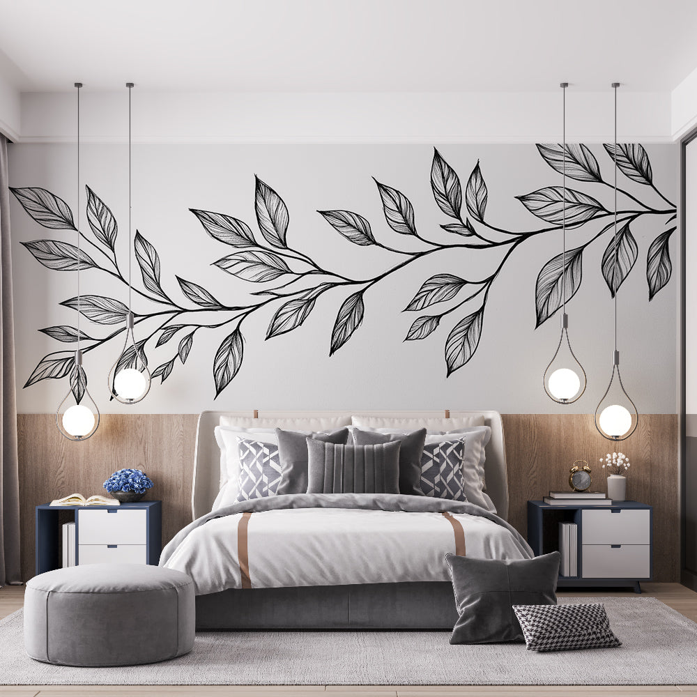 Black and white botanical line art wallpaper creating a serene atmosphere in a modern living room with minimal furniture