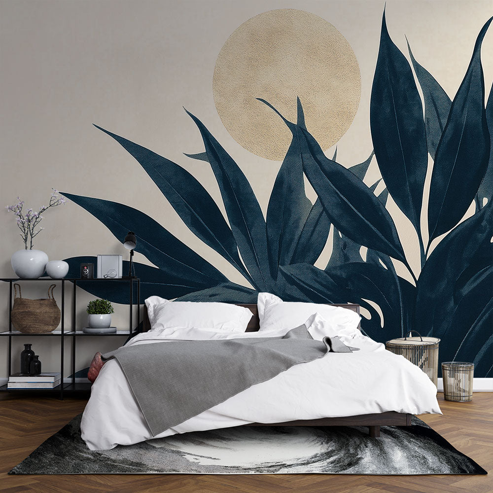Botanical wall mural with dark leaves and golden moon creating a calm atmosphere in a modern living room setting