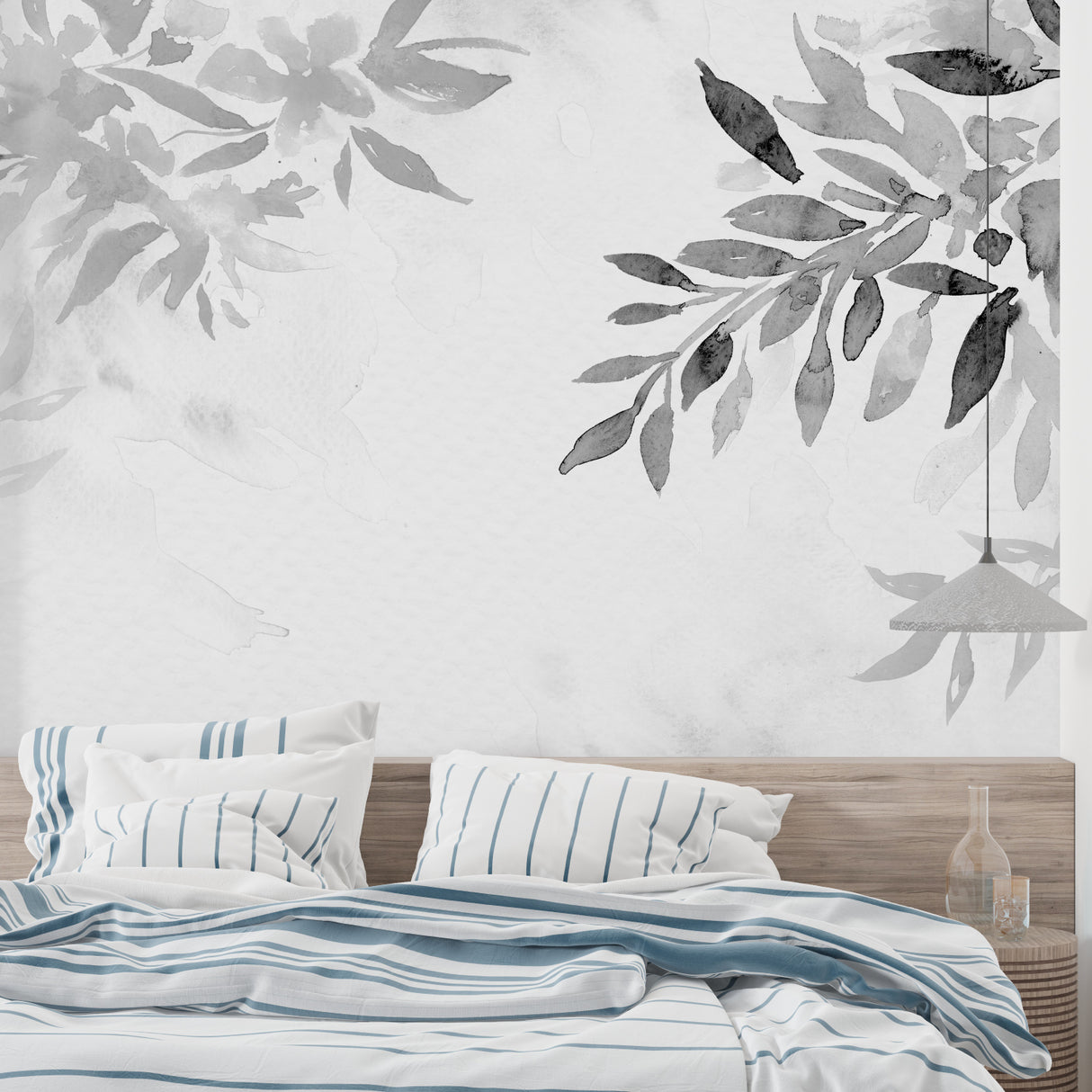 Botanical grey leaf wallpaper creating a serene atmosphere in a modern living room with natural light