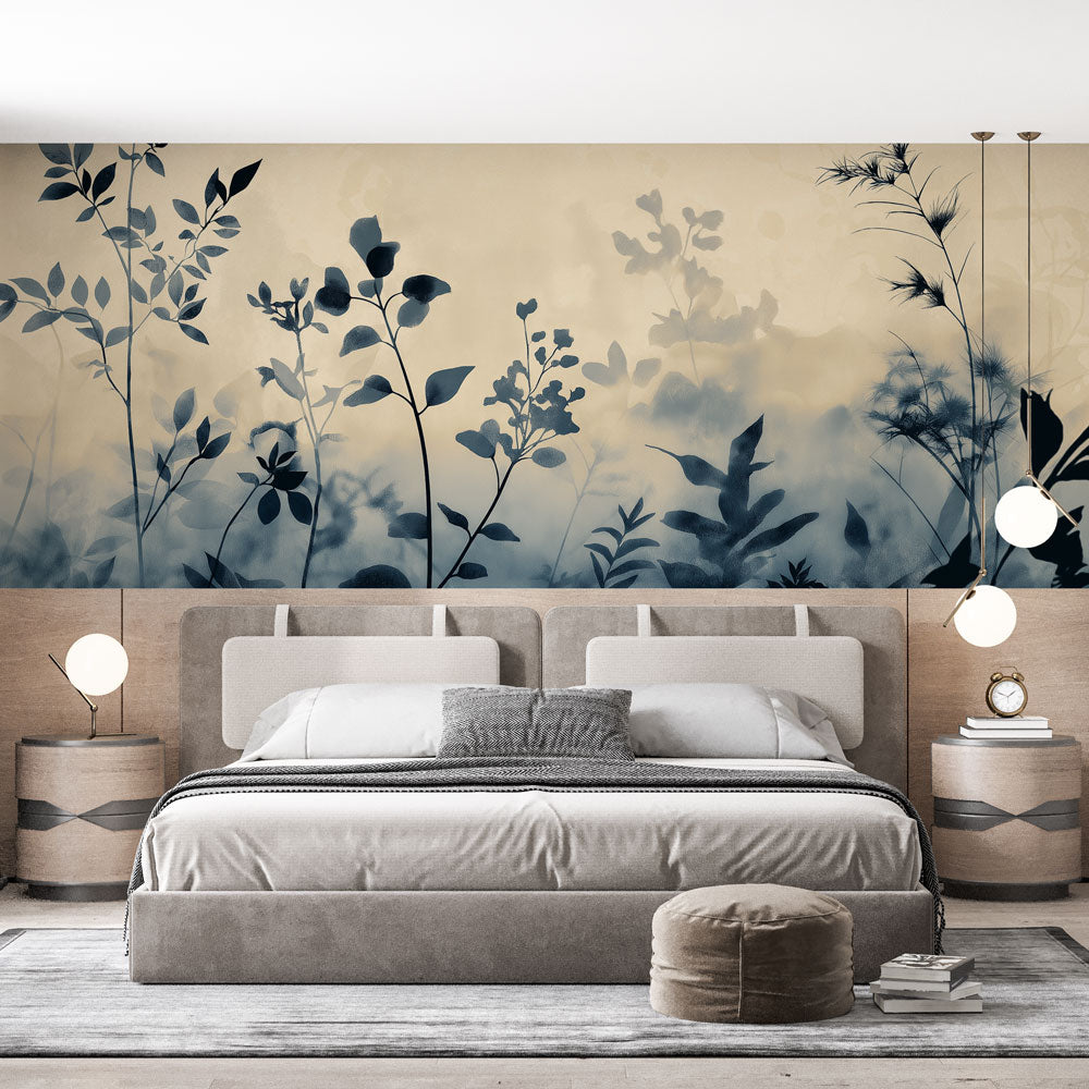 Botanical wall mural with misty blue foliage silhouettes creating depth in a modern living room setting
