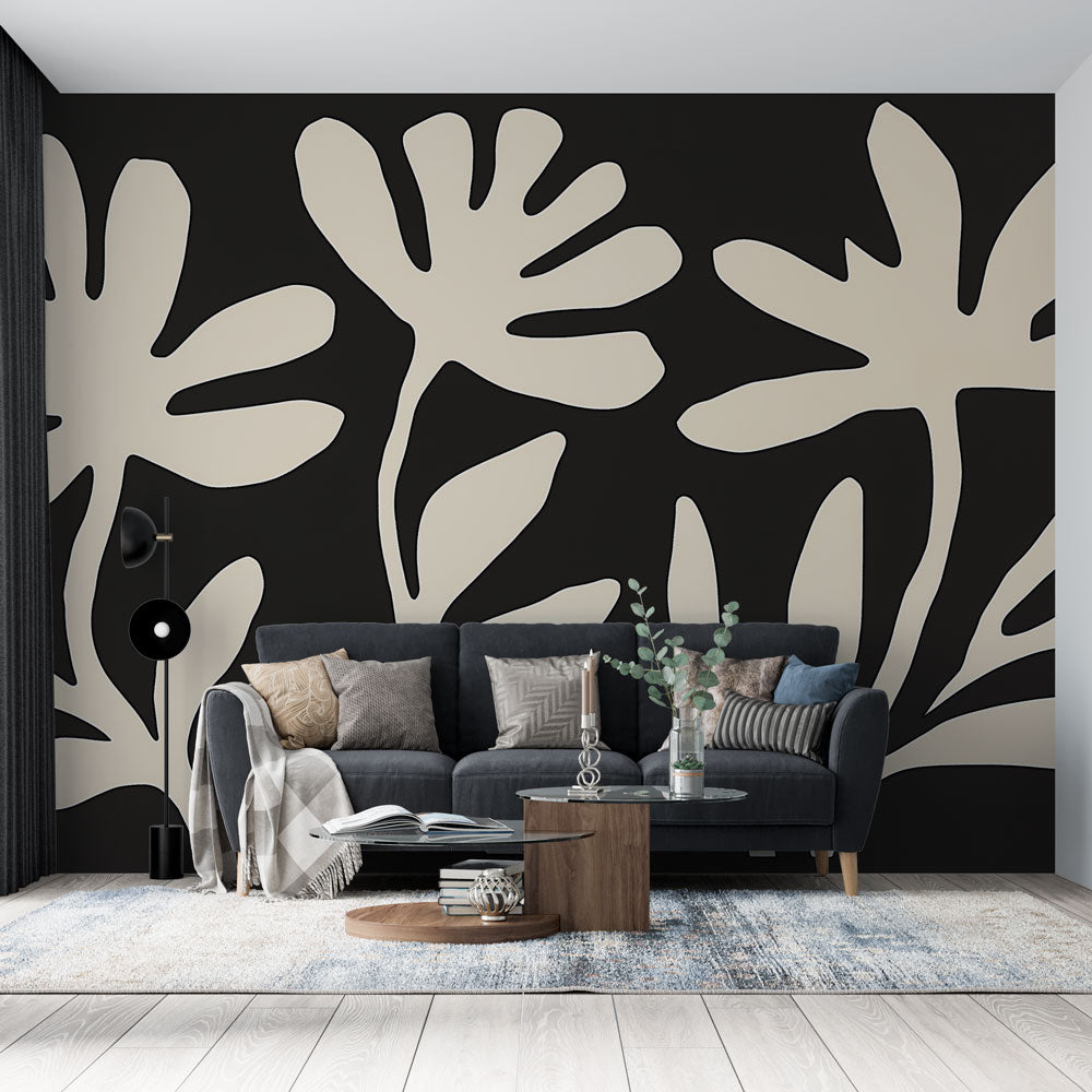 Modern botanical wallpaper in black and white creating dramatic impact in a minimalist living room setting