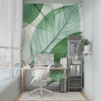 Botanical leaf wallpaper creating a fresh atmosphere in a modern living room with natural light
