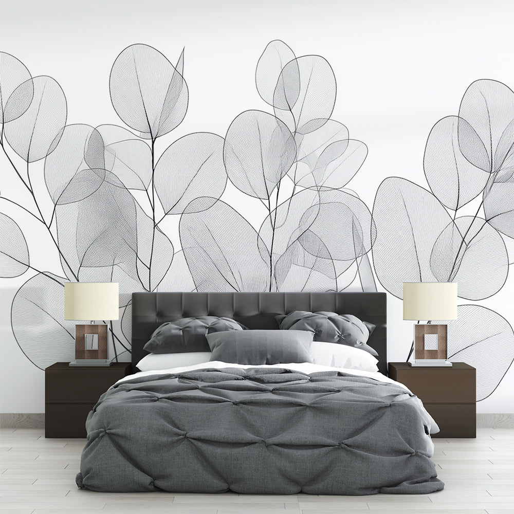 Botanical wallpaper with transparent eucalyptus leaves creating a serene atmosphere in a modern minimalist bedroom
