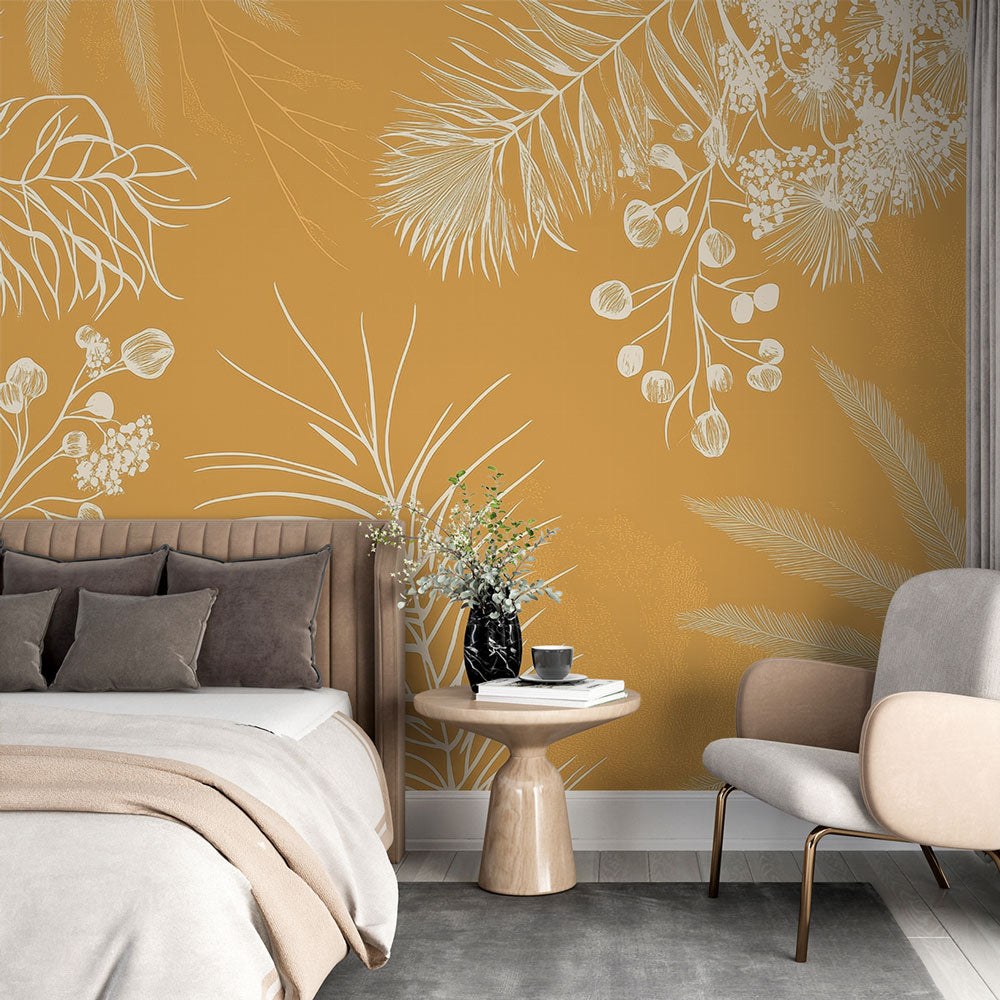 Botanical gold palm leaf wallpaper creating a luxurious atmosphere in a modern dining room with soft lighting