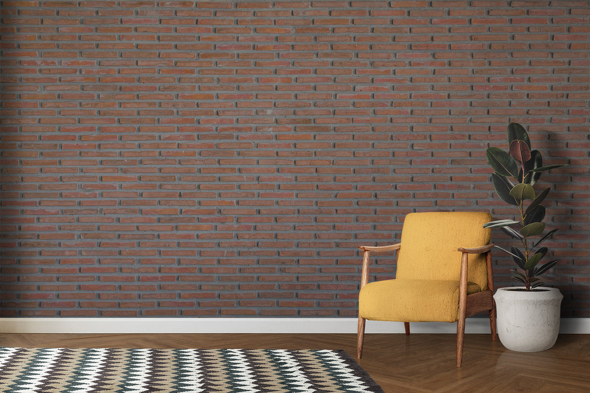 Red clay brick mural wallpaper in home office with wooden desk and metal chairs