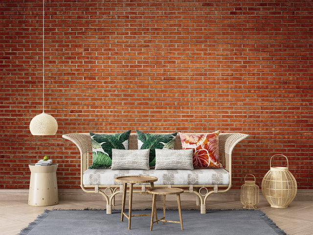 Brick effect wallpaper creating an urban loft feel in modern living room with gray sofa