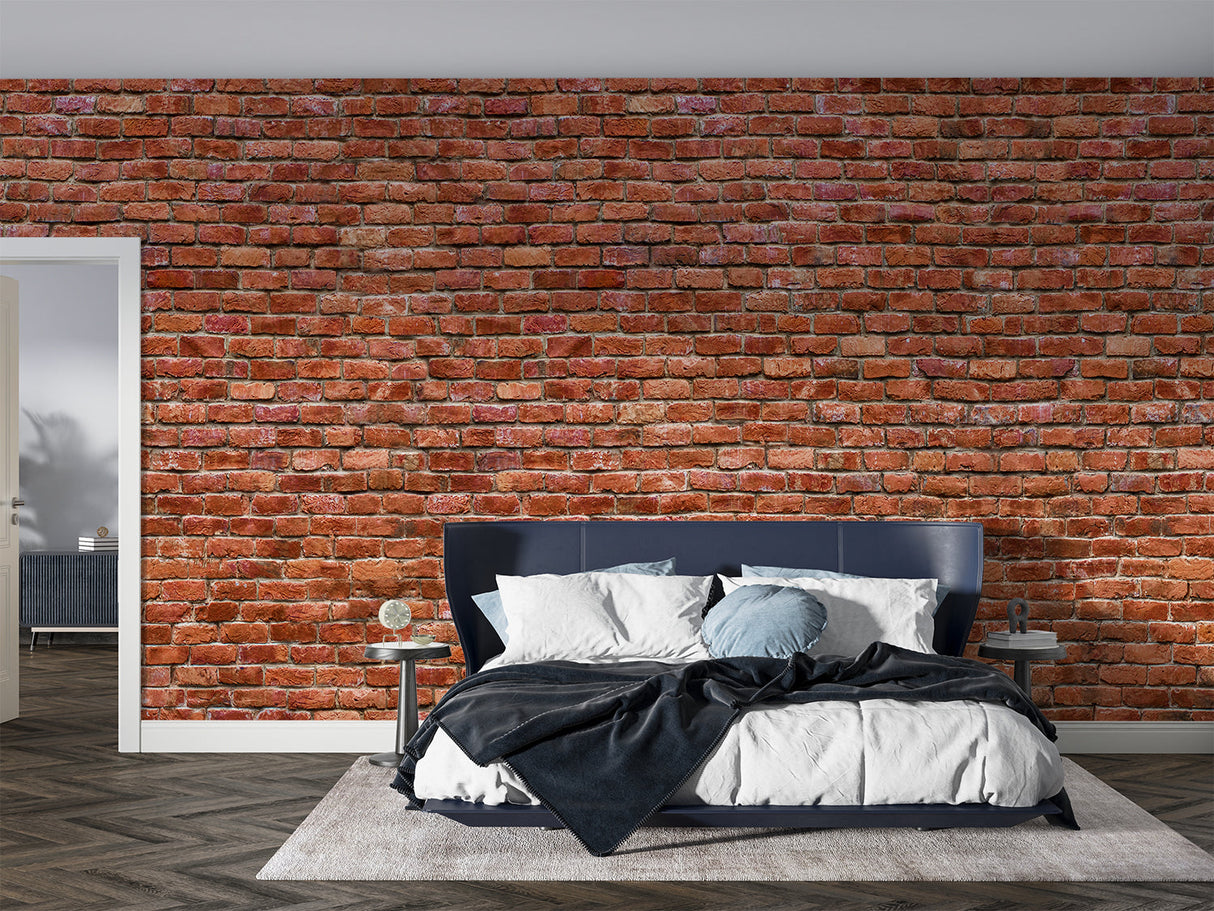 Red brick wallpaper creating industrial charm in modern living room with grey sofa