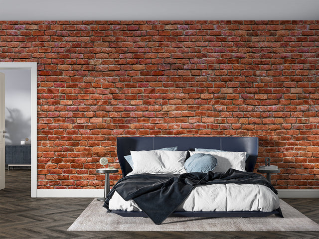 Red brick wallpaper creating industrial charm in modern living room with grey sofa