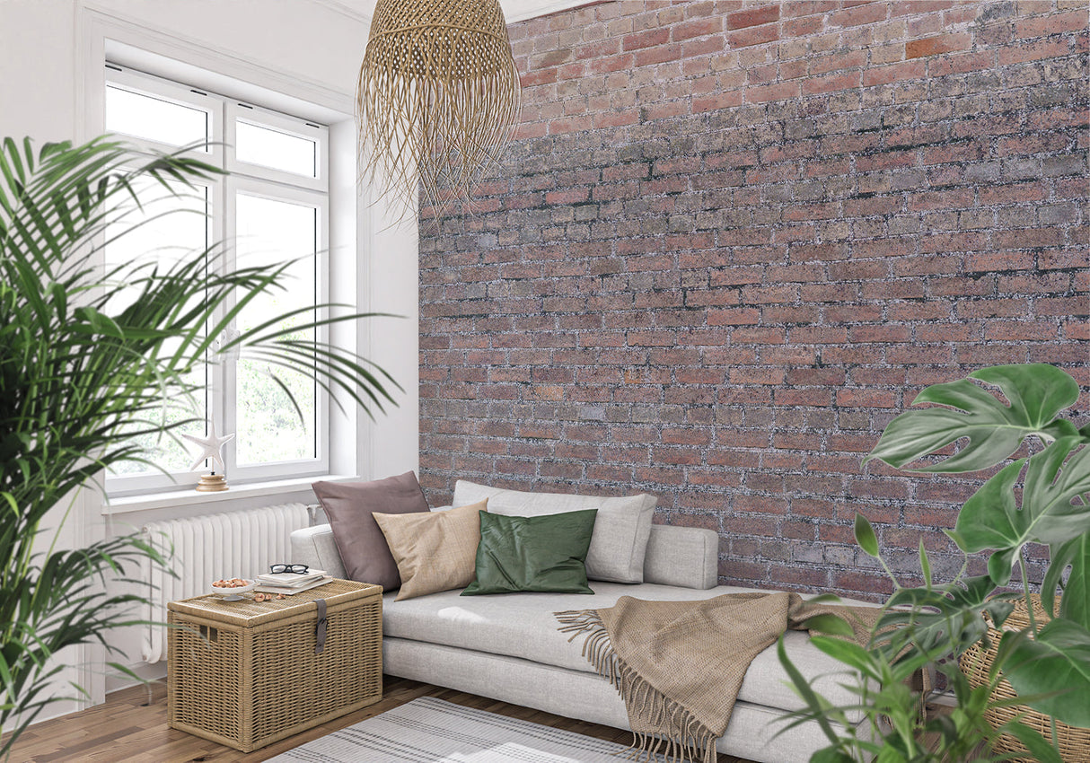 Industrial brick wallpaper in modern living room with grey sofa and metal accents
