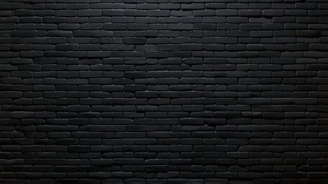 Black brick wallpaper in modern living room with leather sofa and metal lighting fixtures