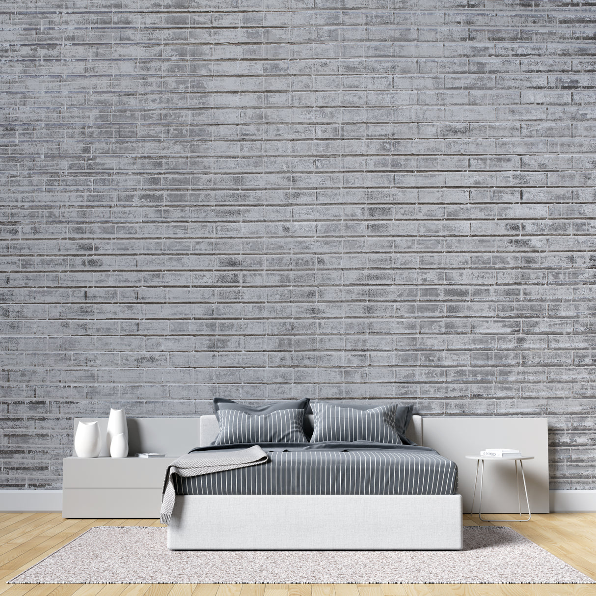 Grey brick mural wallpaper in loft-style bedroom displaying texture detail