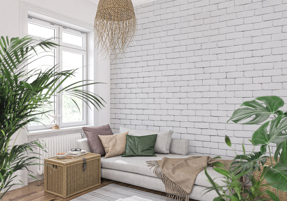 White brick mural wallpaper in modern living room with gray sofa and plants