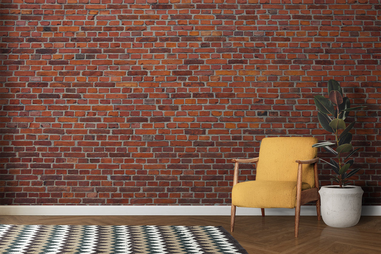 Red brick wallpaper creating an industrial accent wall in a modern living room with leather sofa and metal fixtures