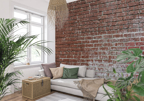 Vintage brick wallpaper in modern living room creating industrial charm with leather sofa and metal accents